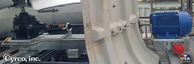 Custom Built Stainless Steel Mechanical Equipment Support with an Amarillo Gearbox and New Motor Mounted Inside a Smaller Field Erected Cooling Tower's Fan Stack. Custom stainless steel mechanical equipment support mount with Amarillo gearbox and new motor mounted