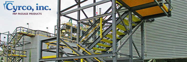Multiple Custom Fabricated FRP Composites Multi-Level Stair Towers with High Visibility Yellow Hand and Toe Railings, and Walkways Throughout an Industrial Manufacturing Plant.